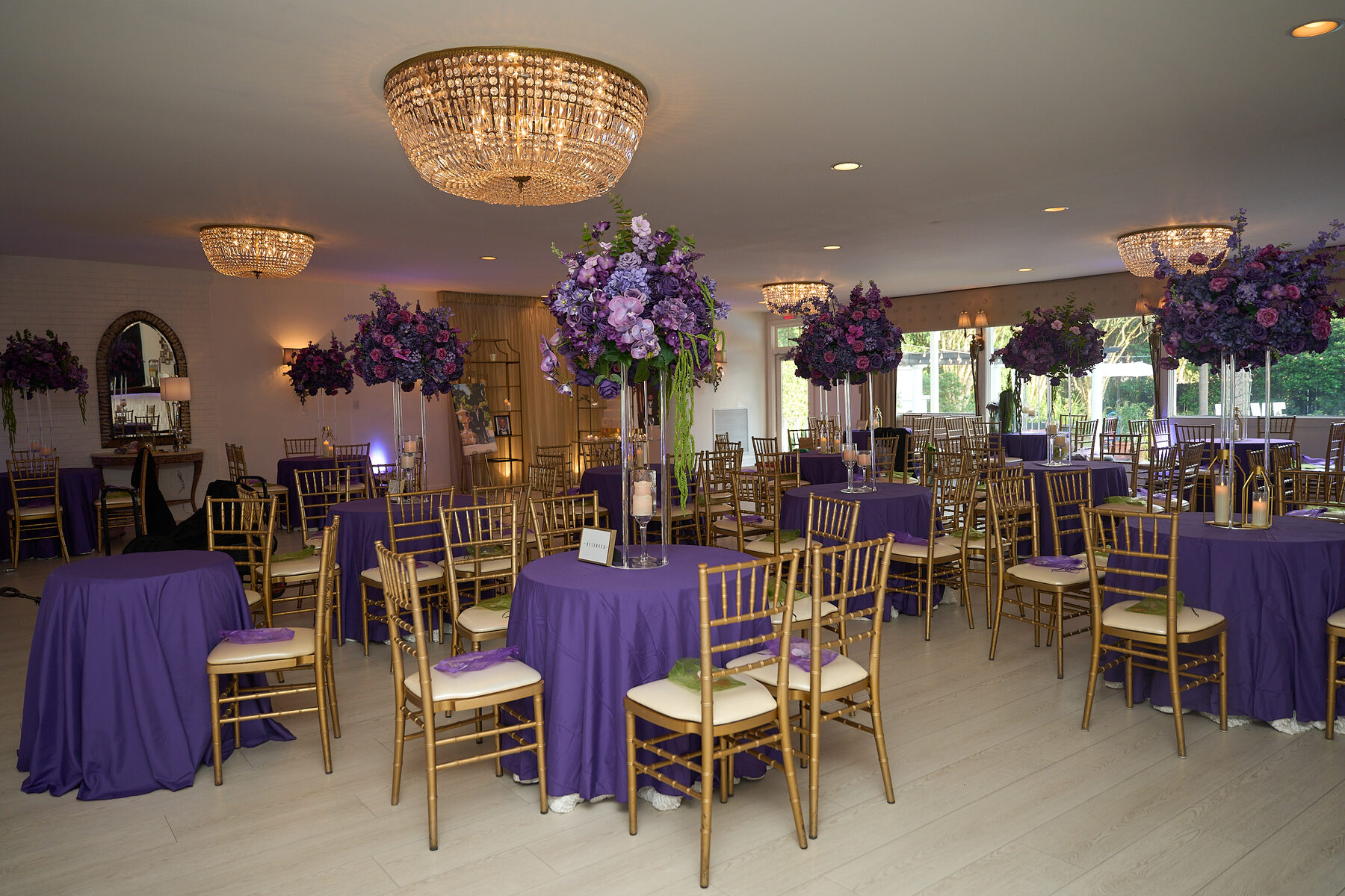 Elegant purple and gold wedding reception ballroom table setting